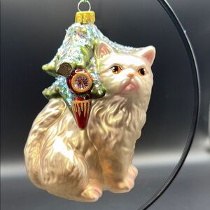 Festive Christmas Cat Ornament under a Sparkling Green Tree